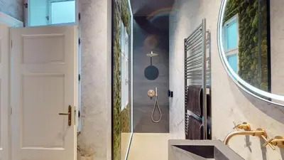 a bathroom with a sink and a mirror at Naprstek Castle View Residence in Prague