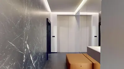 a room with a black marble wall and a brown box at Naprstek Castle View Residence in Prague