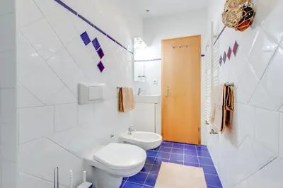 a bathroom with a toilet and a sink at Romantic apartment by the park - uaka7 in Prague