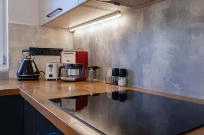 a kitchen with a counter with a coffee maker on it at Family Friendly Spacious Two Floor B&B Prague in Prague