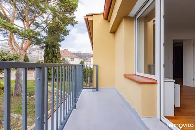 a balcony with a view of a house at Family Friendly Spacious Two Floor B&B Prague in Prague