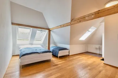 a bedroom with two beds in a attic at Family Friendly Spacious Two Floor B&B Prague in Prague