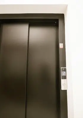 a close up of a metal door in a building at Luxemi Apartments I City Center Premium Studio in Prague