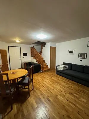 a living room with a table and a couch at 1 Bed Flat - Sleeps 4 - Pets - Smoking on terrace in Prague