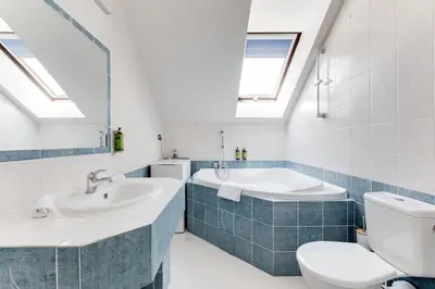 a bathroom with a toilet and a sink and a tub at Wenceslas Square Royal Apartments in Prague