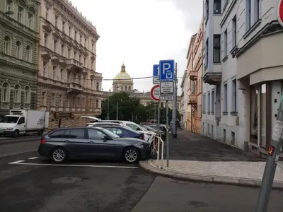 a car parked in a parking lot on a city street at 3Brothers Homestay in Prague