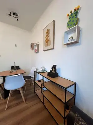 a room with a table and a table and chairs at Pražský byt s dobrou dostupností in Prague
