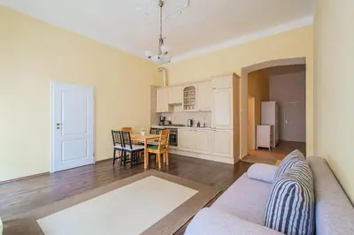 a living room with a couch and a table at Spacious oasis in Prague's Heart in Prague