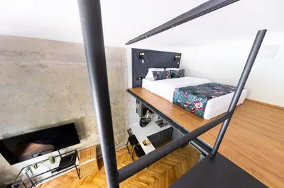 a bedroom with a bunk bed and a bed at Bohéme Apartments - Karlín in Prague