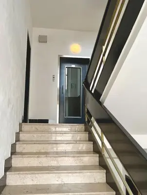 a staircase leading to a door in a building at Luxury Apartment in Old Town in Prague