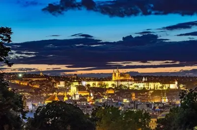 a view of a city at night at Best location in Prague! 4 bedrooms and super host! in Prague
