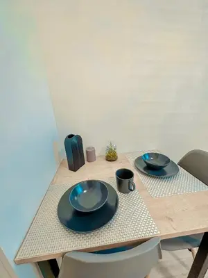a table with two plates and two cups on it at My Mozartova in Prague