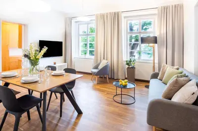 a living room with a table and a couch at River View Apartment in Prague
