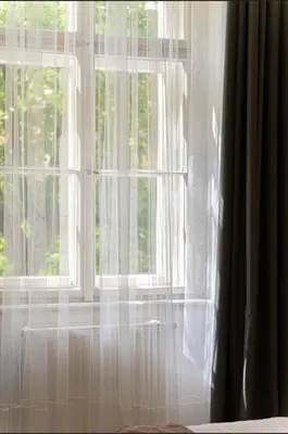 a window with white curtains in a room at 1# Fancy share Apartment with Own Bathroom in Prague