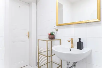 a white bathroom with a sink and a mirror at 1# Fancy share Apartment with Own Bathroom in Prague