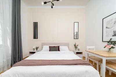a bedroom with a large bed and a desk at 1# Fancy share Apartment with Own Bathroom in Prague