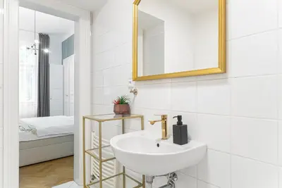 a white bathroom with a sink and a mirror at 2# Fancy share Apartment with Own Bathroom in Prague