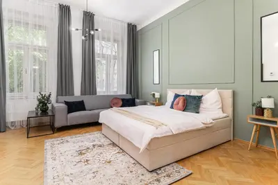 a bedroom with a bed and a couch at 2# Fancy share Apartment with Own Bathroom in Prague