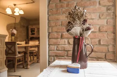 a vase with flowers in it sitting on a table at Chalupa pod Řípem in Straškov