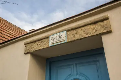 a building with a sign above a door at Chalupa pod Řípem in Straškov