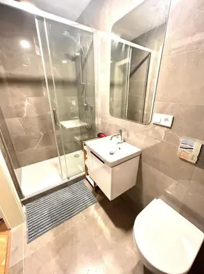 a bathroom with a shower and a toilet and a sink at NewAPT next to Wenceslas Square in Prague