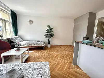 a living room with a couch and a table at NewAPT next to Wenceslas Square in Prague