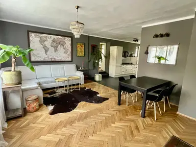 a living room with a white couch and a table at Good Times in Prague