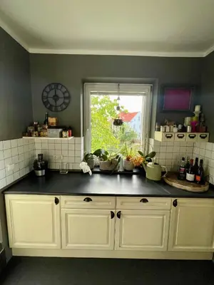 a kitchen with a counter top with a window at Good Times in Prague