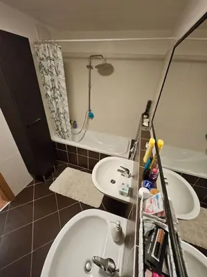 a bathroom with a sink and a shower and a tub at Nádherný byt v krásném prostředí in Prague