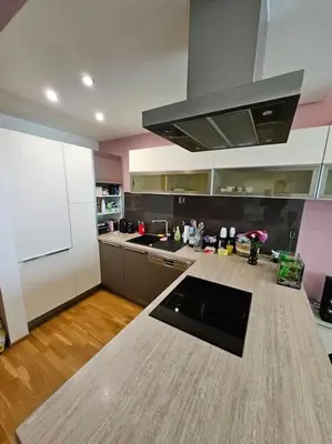 a kitchen with a counter top in the middle of it at Nádherný byt v krásném prostředí in Prague