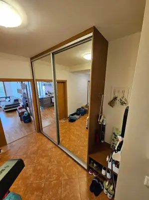 a living room with a sliding glass door at Nádherný byt v krásném prostředí in Prague