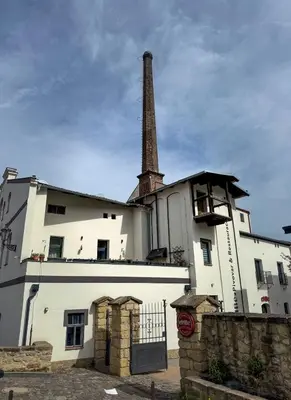 a building with a tower on top of it at River Apartments in Mladá Boleslav