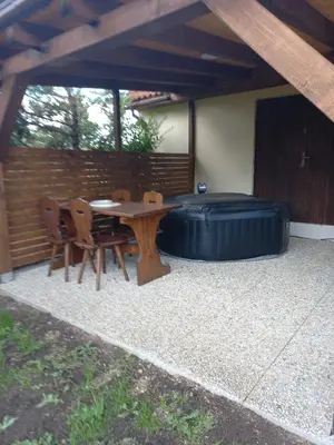 a patio with a table and chairs and a large inflatable at Rekreační dům in Dobříš