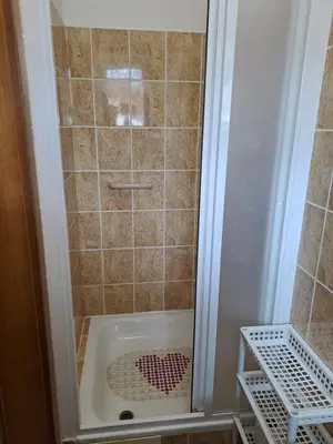 a shower with a bath tub in a bathroom at Rekreační dům in Dobříš
