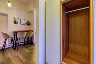 a dining room with a table and chairs and a door at Prague Milada & Heaven Home Apartment in Prague