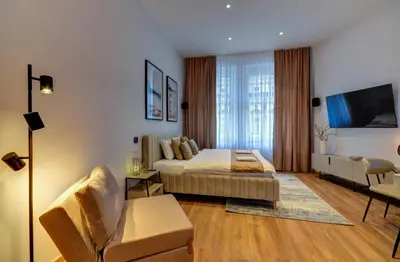 a bedroom with a bed and a living room at Prague Milada & Heaven Home Apartment in Prague