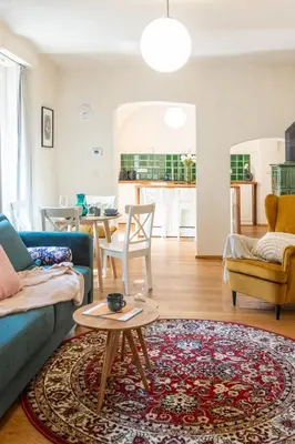a living room with a couch and a table at Prague Days - Two-bedroom Apartment with Workspace and Balcony in Old Town in Prague