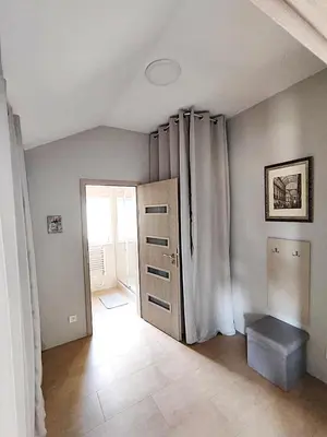 a room with a door and a window and a room with a door at Apartmány U Obory in Nechánice