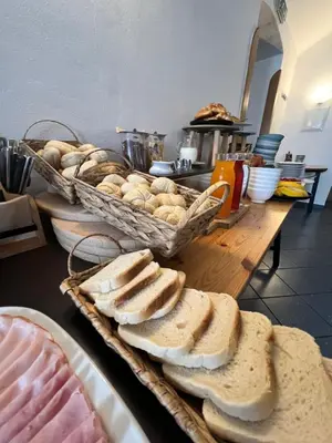 a table with bread and baskets of food on it at hotel Florian Sedlčany in Sedlčany