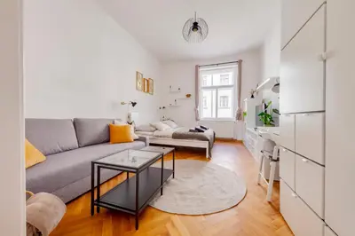 a living room with a couch and a table at Premium Apartment Nearby Centre in Prague