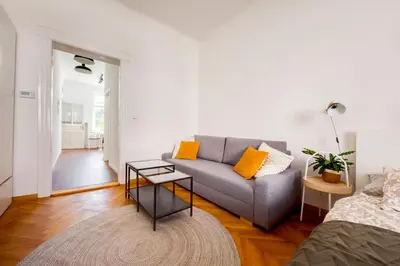 a living room with a couch and a table at Premium Apartment Nearby Centre in Prague