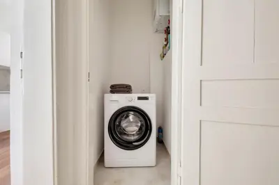 a washer and dryer in a small room at Premium Apartment Nearby Centre in Prague