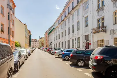 a row of parked cars on a city street at Premium Apartment Nearby Centre in Prague