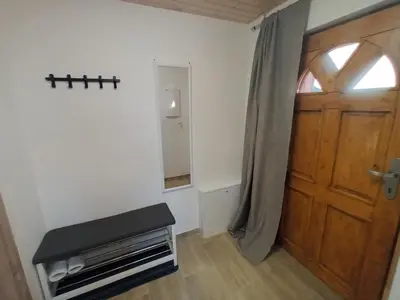a room with a wooden door and a window at Apartmán Svaté Pole in Svaté Pole
