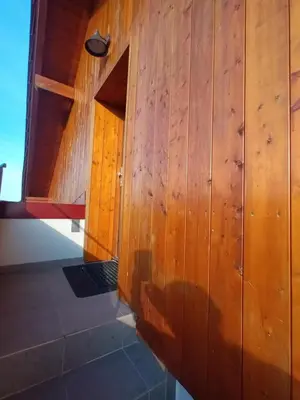 a wooden wall with a door in a room at Apartmán Svaté Pole in Svaté Pole