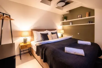 a bedroom with a large bed in a room at AC Old Town Grand Luxury&Family Loft in Prague