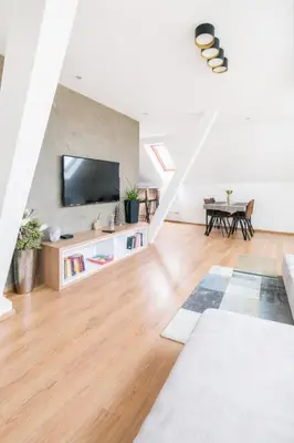 a dining room with a table and chairs at Apartmán VALORI - 100m2 in Poděbrady