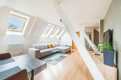 a bathroom with a sink and a mirror at Apartmán VALORI - 100m2 in Poděbrady