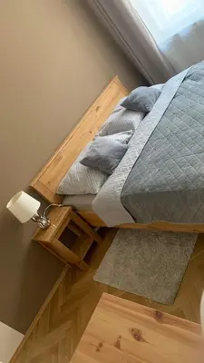 a bed in a room with a window at Anenska by Charles Bridge 3 in Prague