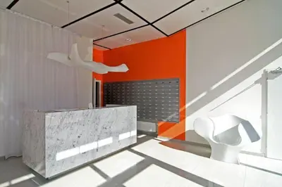 a bathroom with an orange and white wall at Cozy apartment fully equipped in Prague